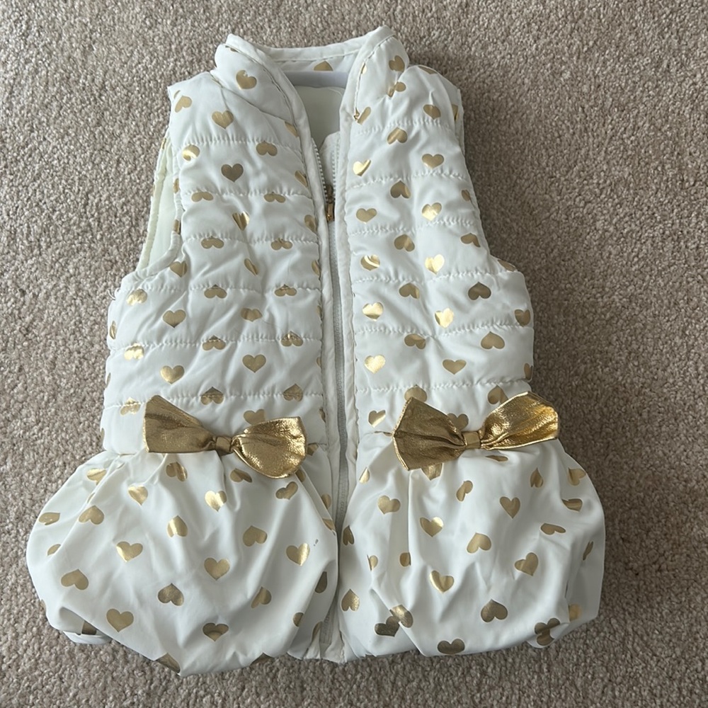 White and gold vest with hearts and bows size is 2T really good condition!